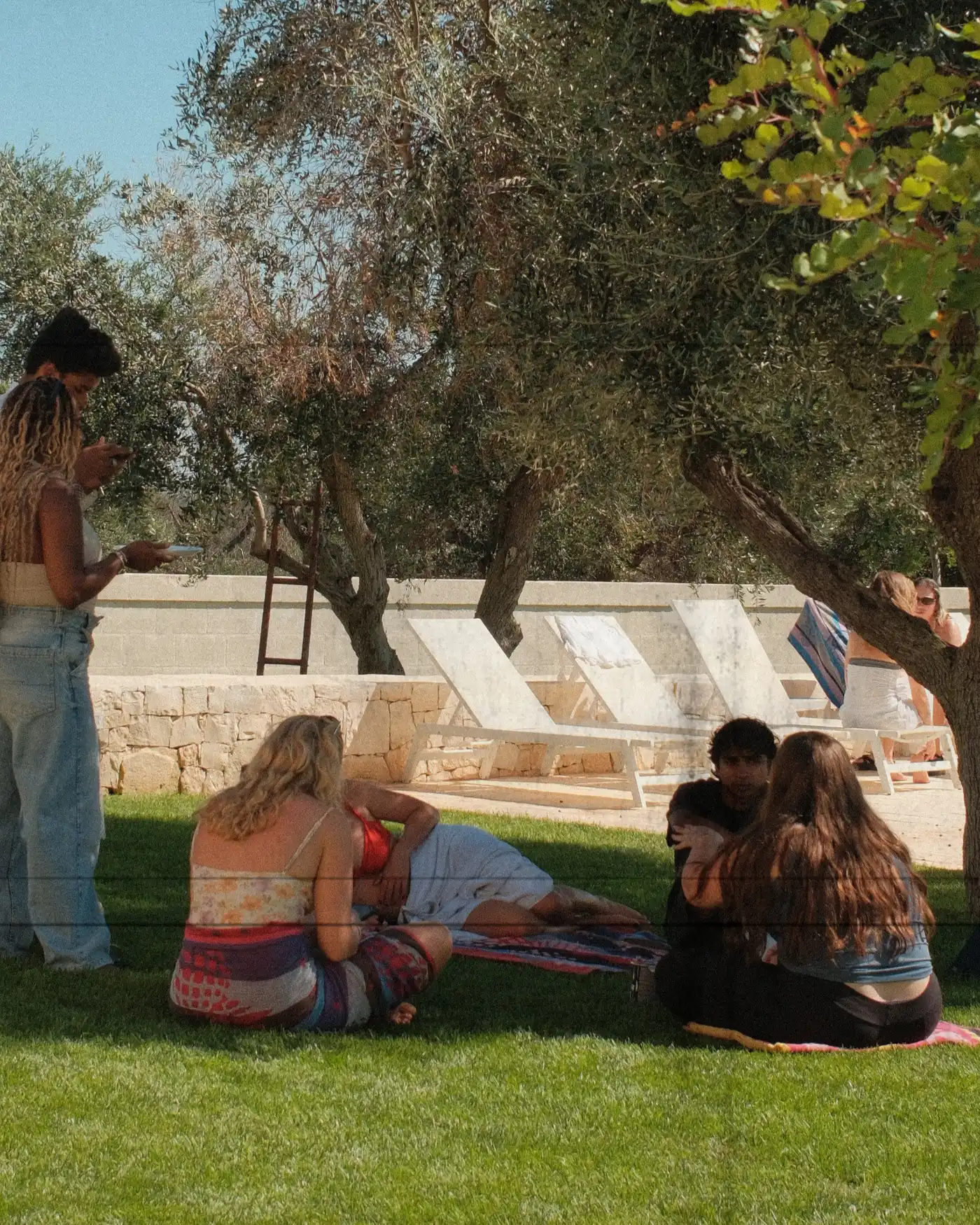 Songwriting session on the villa lawn at a previous camp