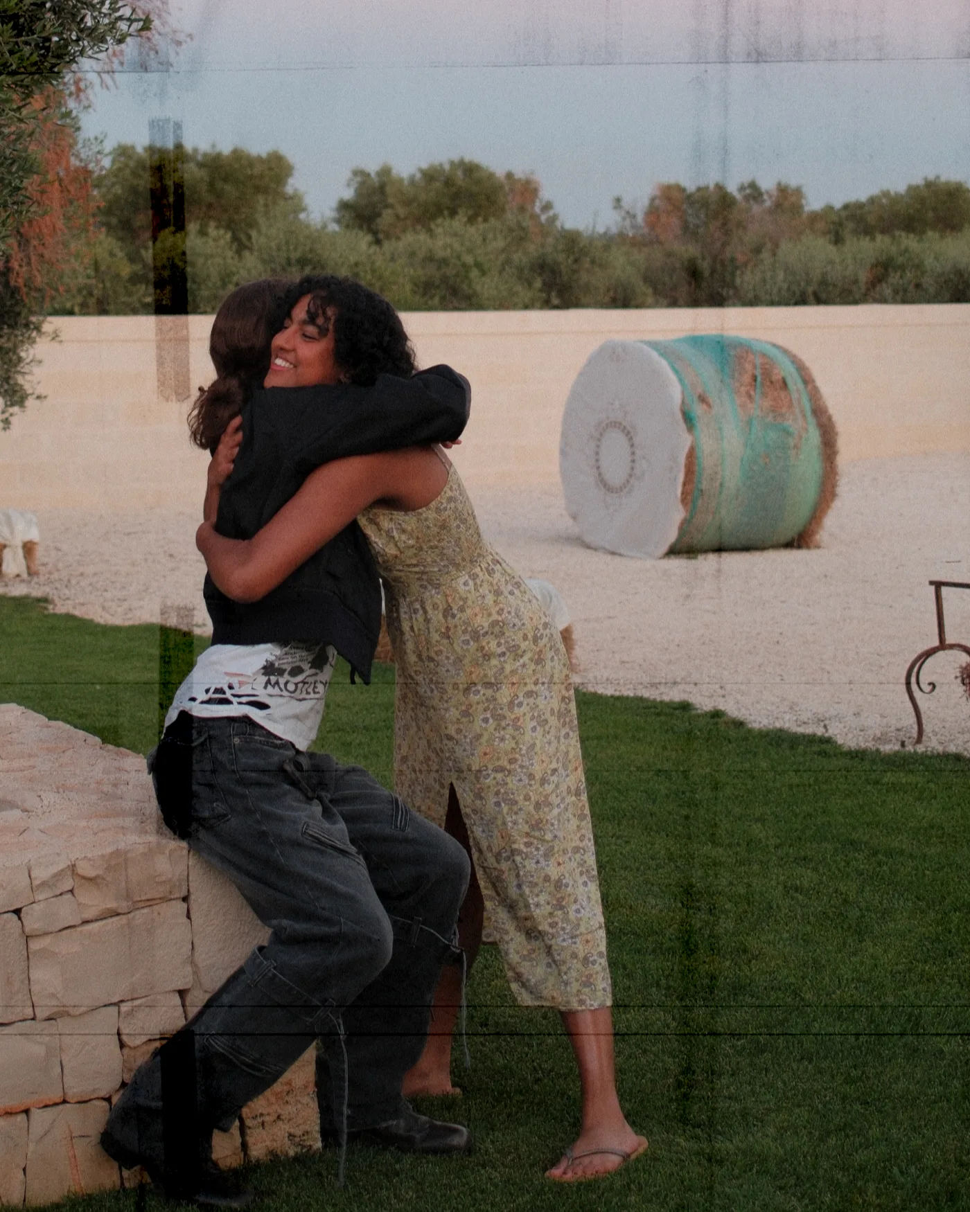 Two campers embracing at a previous songwriting camp